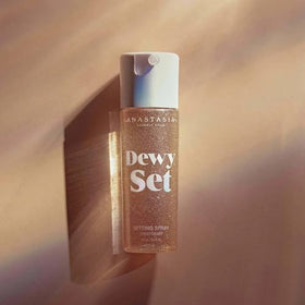 Anastasia Beverly Hills Dewy Set in hand for size and scale, showing travel-friendly convenience and portability benefit