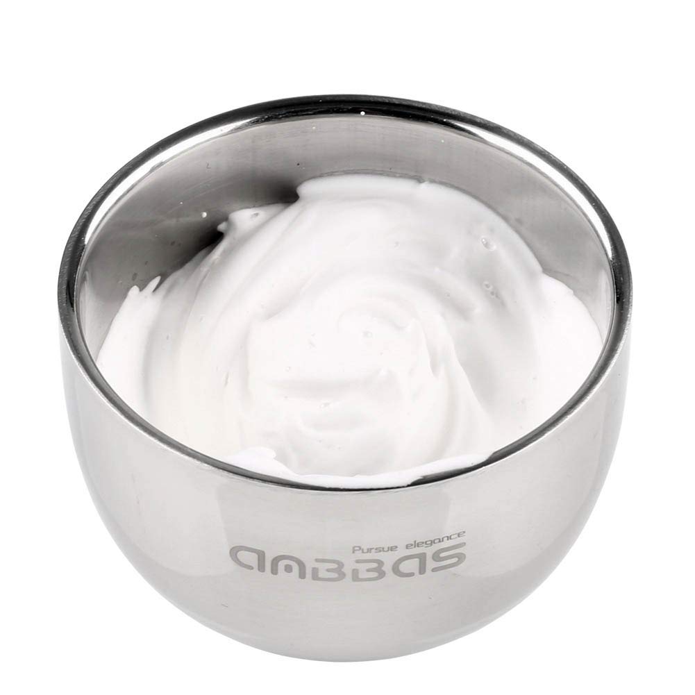 Anbbas brush creating rich lather in bowl during wet shave