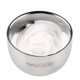 Anbbas brush creating rich lather in bowl during wet shave