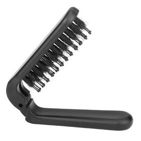 Ancable folded brush front view showing compact travel-ready design