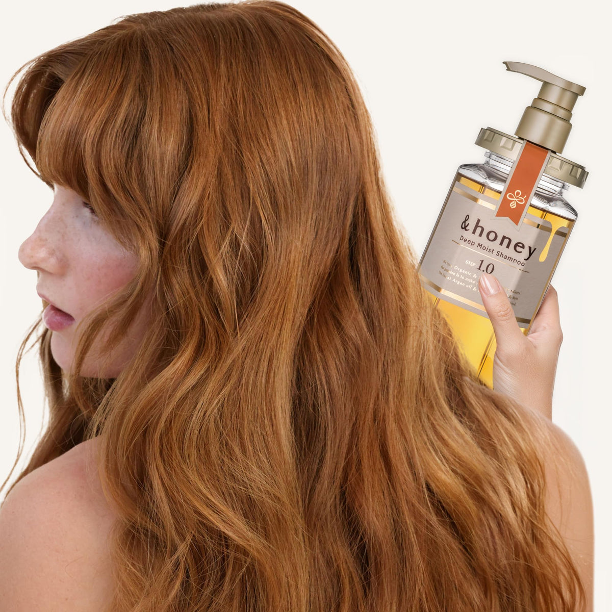 &honey conditioner texture in hand illustrating rich creaminess for smoothing frizz