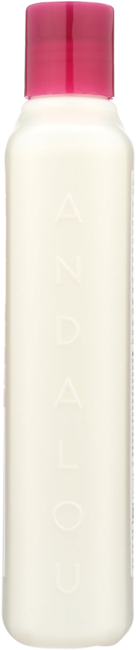 Andalou Naturals shampoo bottle staged on bath shelf suggesting everyday routine