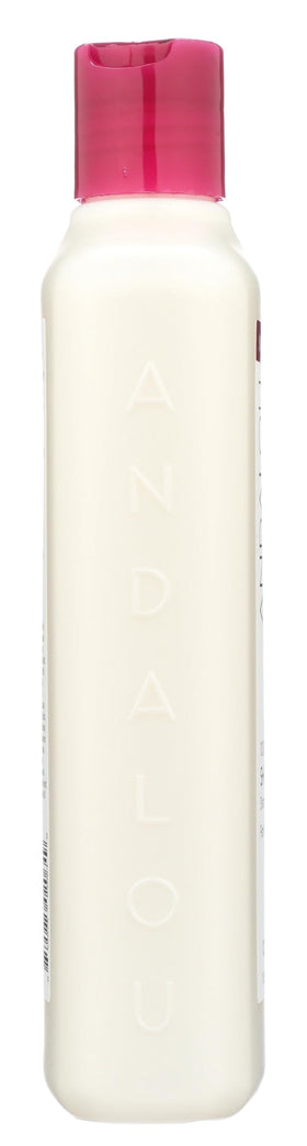 Andalou Naturals 11.5 fl oz bottle beside a tape measure showing size perspective