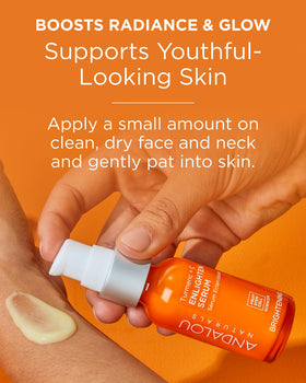 Andalou Naturals bottle beside turmeric root showing natural ingredient focus and antioxidant benefit