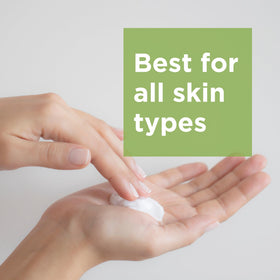 Andalou Naturals 8 fl oz bottle next to hand for size comparison and travel-ready convenience