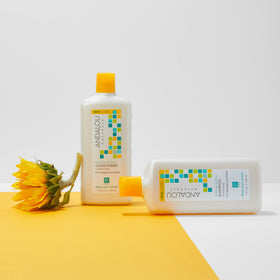 Shampoo lather in hand in bathroom scene highlighting Andalou Naturals gentle cleanse