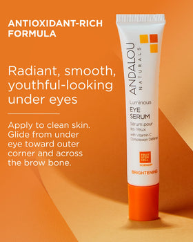 Andalou Naturals applying serum under eye to reduce puffiness appearance