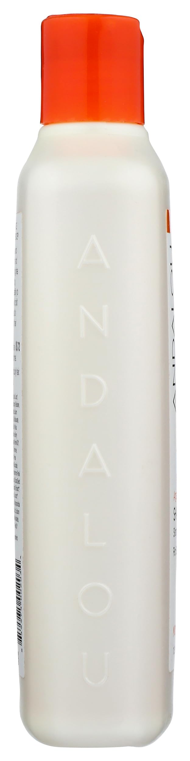 Andalou Naturals shampoo in hand on wet hair demonstrating easy application