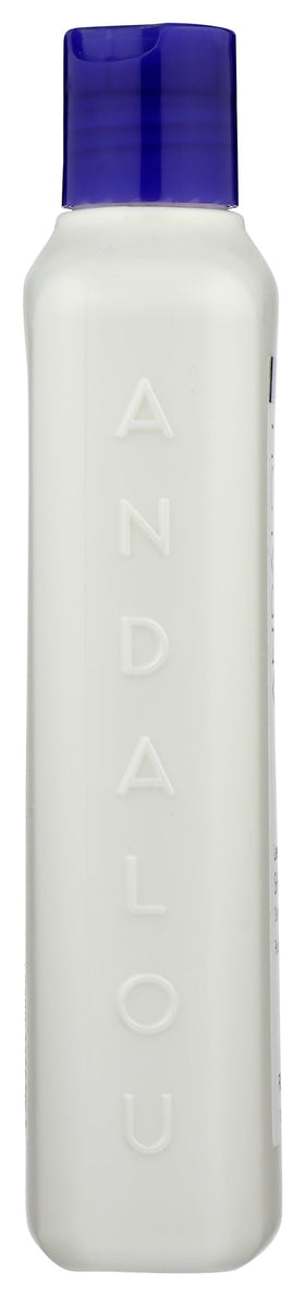 Andalou Naturals shampoo poured on hair strand showing lightweight coating