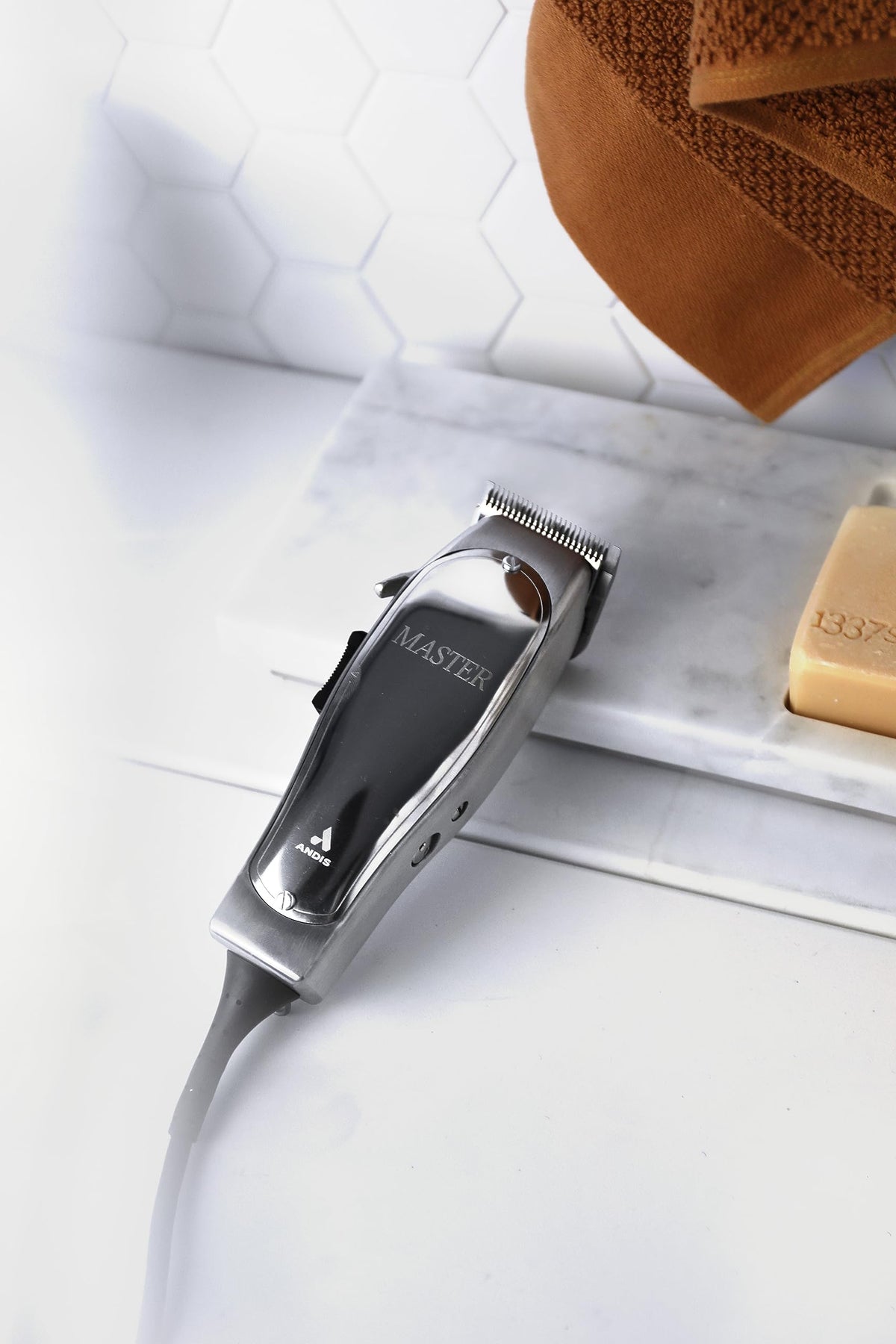 Andis blade adjustment mechanism detail enabling quick length changes and clean lines