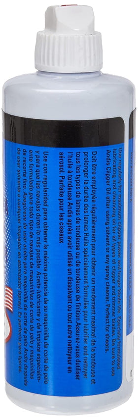 Close-up squeeze-top detail on Andis bottle for precise oiling control