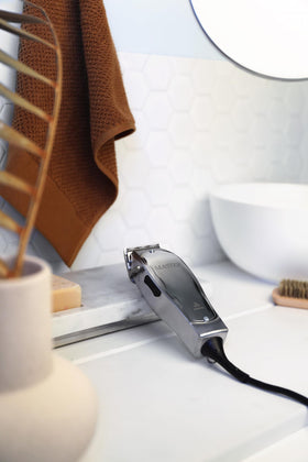 Andis trimming a client’s hair demonstrating smooth cutting performance and precision