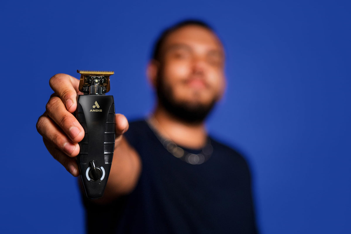 Andis GTX-EXO held in hand demonstrating clear blade visibility for detailing