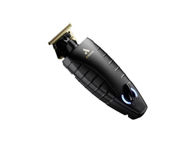 Andis GTX-EXO next to clipper guards showing compact size and trimming scale