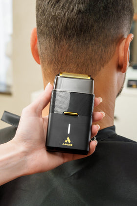 Andis used trimming a neckline to demonstrate precise finishing and professional results