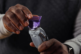 Andis comb set arranged in barbershop setting, organized and ready for fast service
