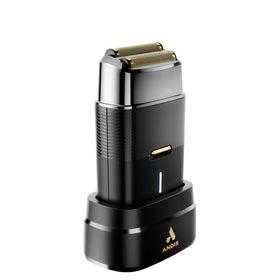 Andis packaging and accessories laid out to show included stand, cap, and travel readiness