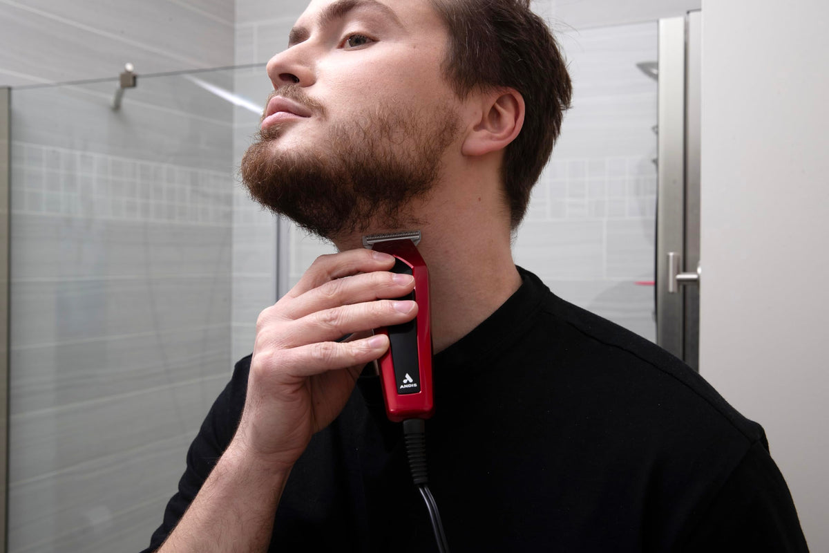 Andis Ultra Clip held in hand showing compact size and comfortable handling benefit