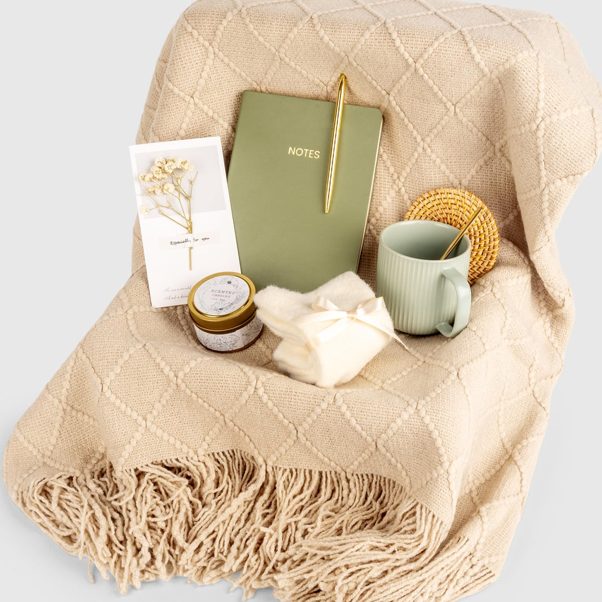 Anforsun candle and accessories flatlay showing notebook, pen, socks and dried card for unboxing delight