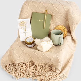 Anforsun candle and accessories flatlay showing notebook, pen, socks and dried card for unboxing delight