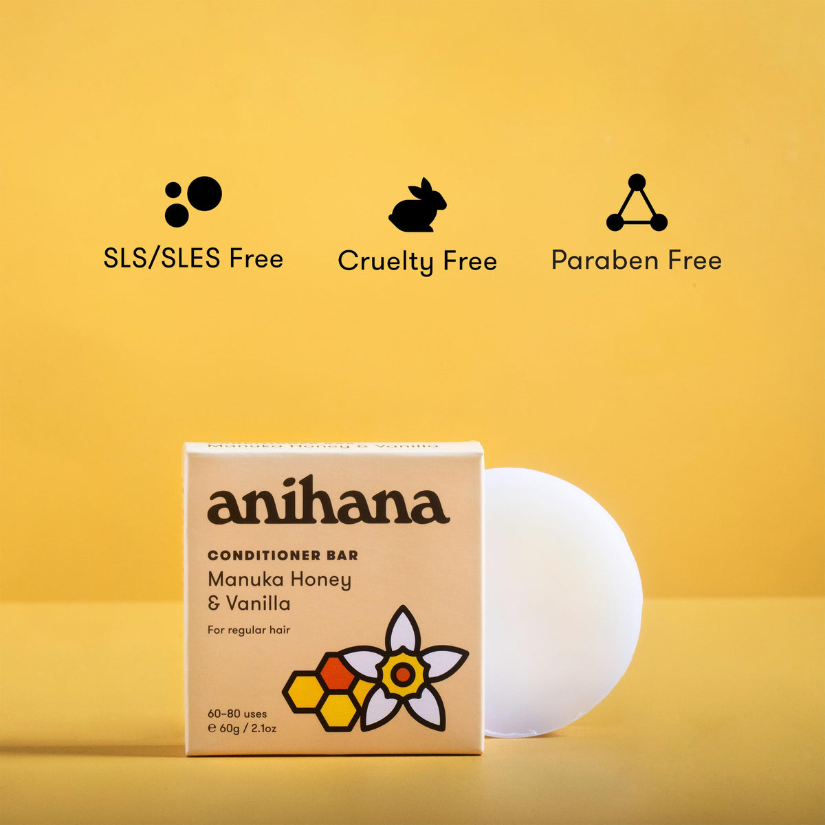ANIHANA conditioner bar in hand next to travel items showing portability