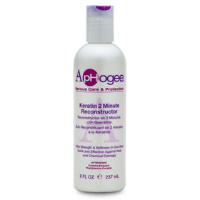 Aphogee bottle held in hand to show 8 fl oz size for home salon use