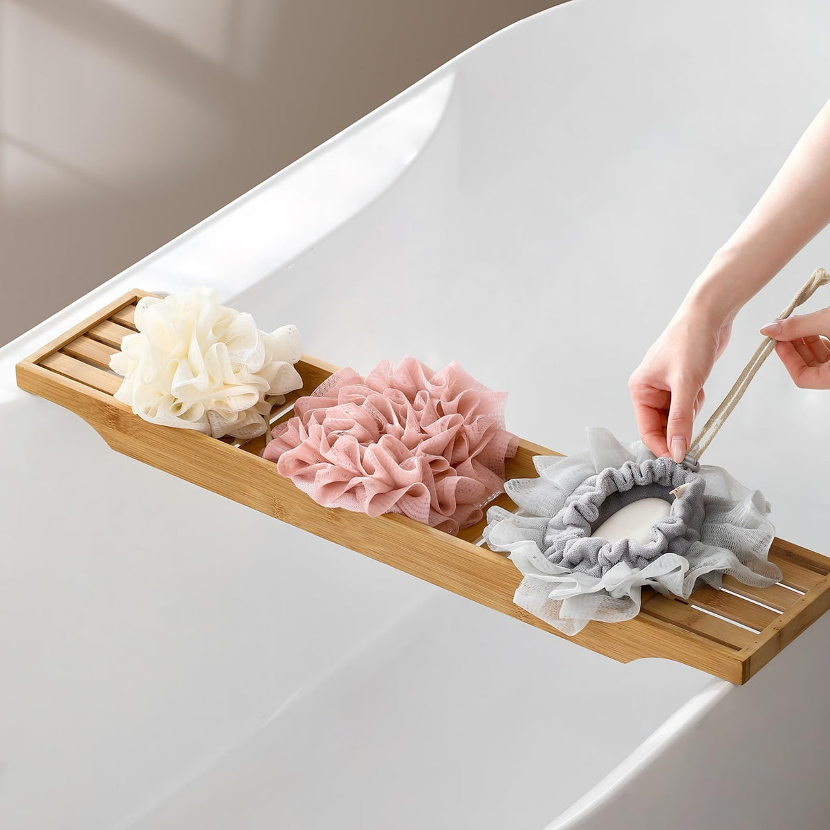 AQOYNQ pouch hanging in shower showing quick-dry and storage benefit