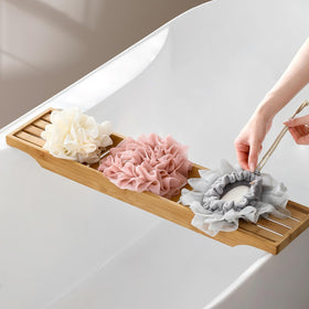 AQOYNQ pouch hanging in shower showing quick-dry and storage benefit