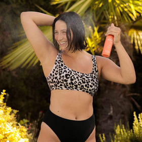 AQUA GUARD in use poolside on damp hair to reduce tangles and frizz