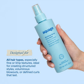 Aquage bottle in hand to show 8 oz scale and easy handling