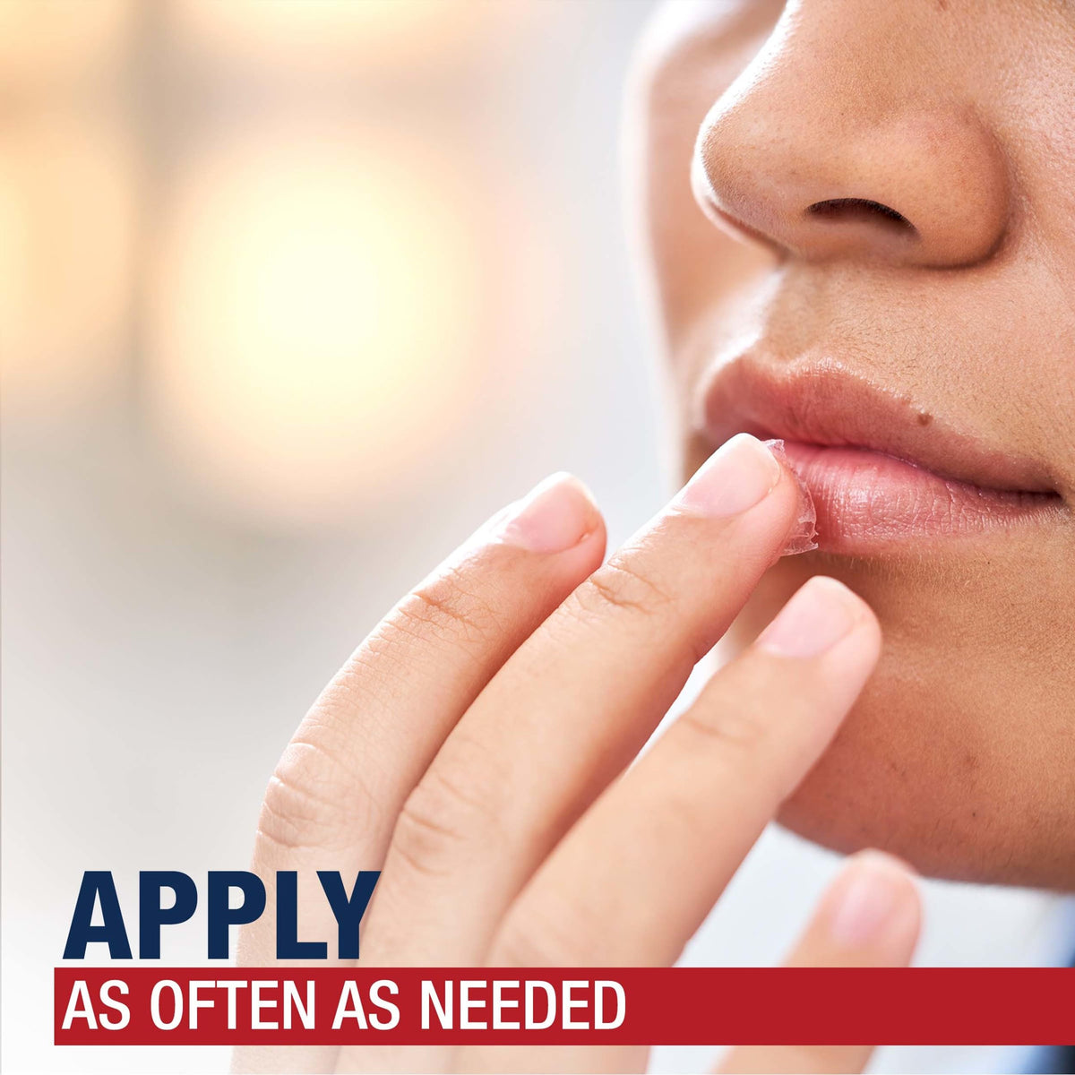 Aquaphor being applied to lips to soothe and seal in moisture