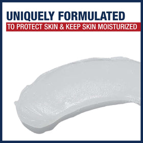 Aquaphor ointment texture on fingertip demonstrating smooth protective layer