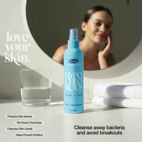 Aquia bottle on bathroom vanity beside skincare products, showing daily routine fit