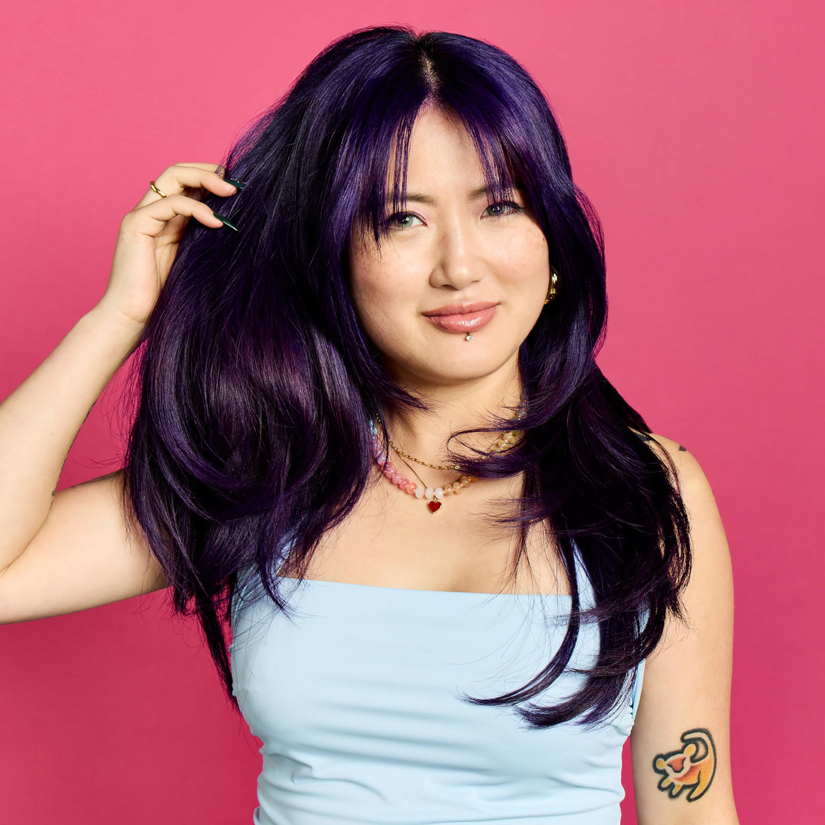 ARCTIC FOX color swatch on hair strand demonstrating vivid purple payoff benefit