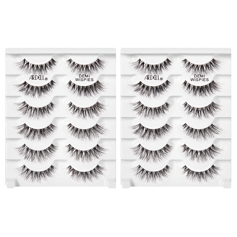 Ardell demi wispies next to fingertip showing compact size and fit