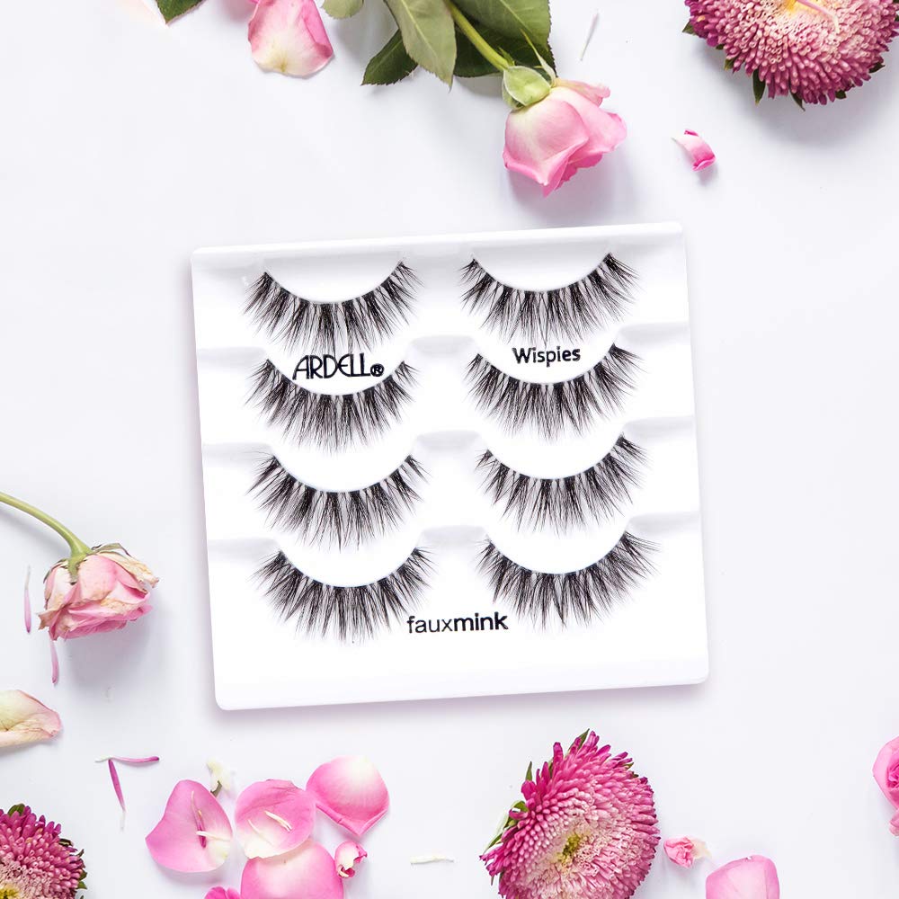 Ardell lashes held by fingers to show size and fit