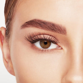 Ardell lash next to ruler showing length and easy trimming guide