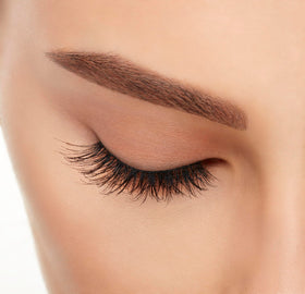 Ardell lashes on model with bold makeup showing dramatic evening lift