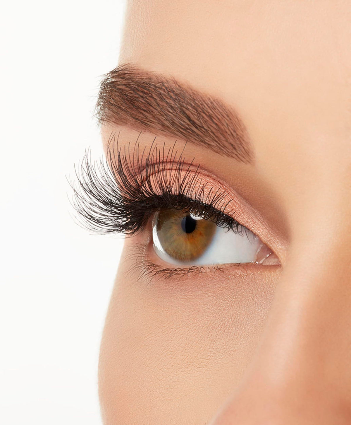 Ardell lashes next to eyeliner showing scale for accurate fit and trimming