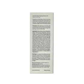 ARENCIA open cap pouring serum to demonstrate lightweight, non-greasy feel