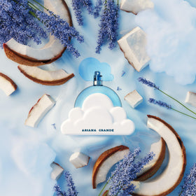 Ariana Grande Cloud lifestyle travel shot bottle beside purse illustrates convenience and uplift