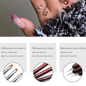 Aridito brushes beside a hand for scale showing tool size and portability