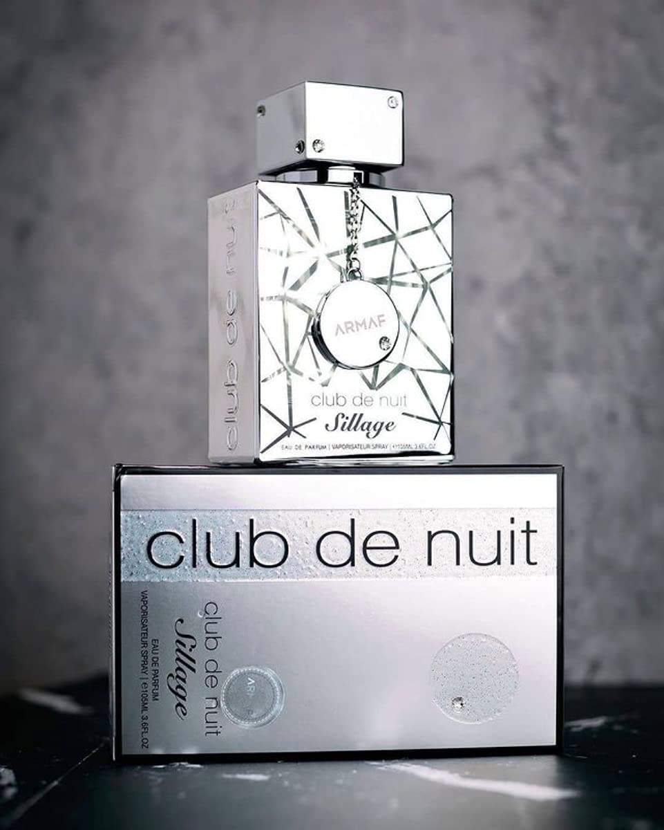 Armaf Club De Nuit Sillage flatlay of notes representing citrus, florals, and woods balance