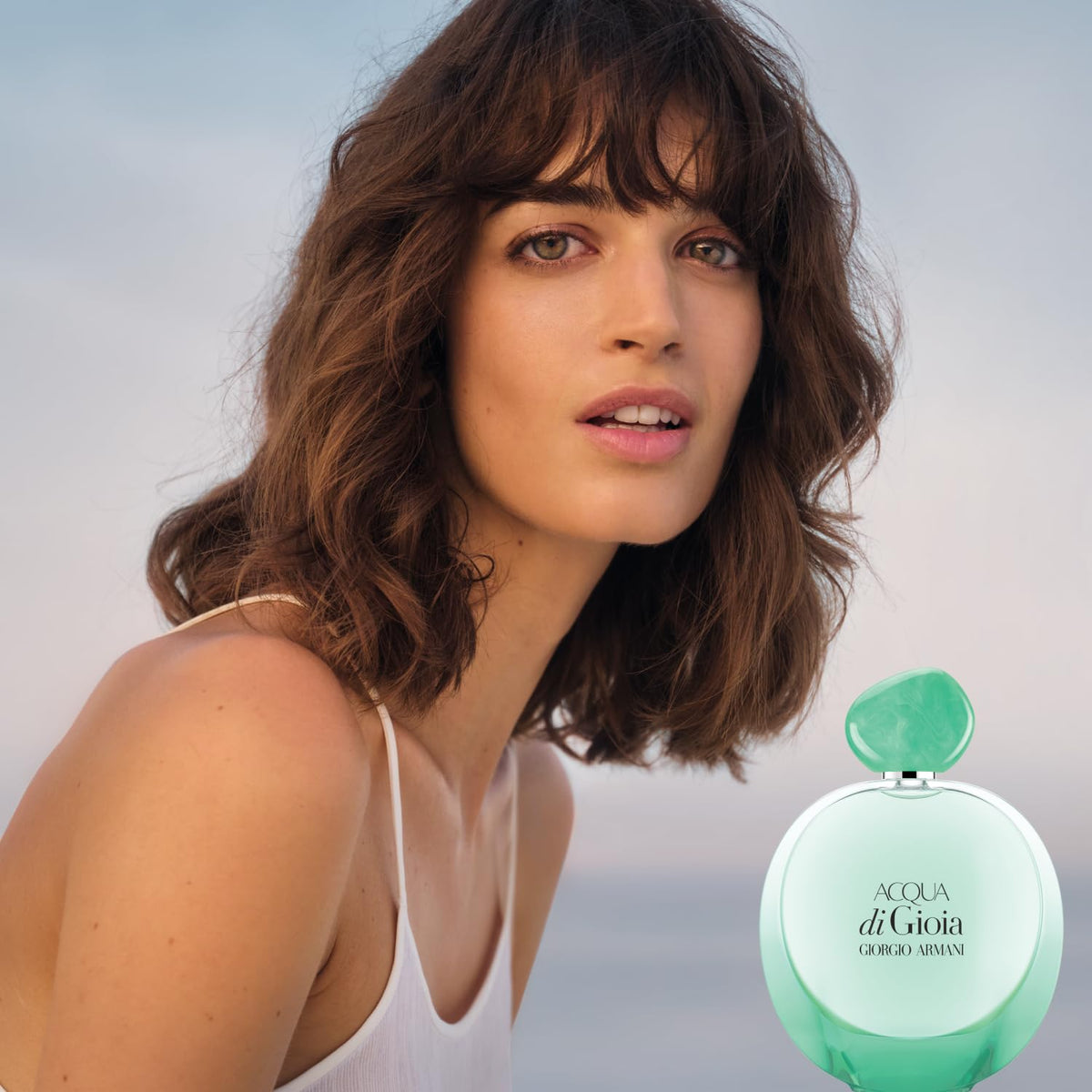 Armani Beauty ingredients display with bergamot and jasmine suggesting fresh florals