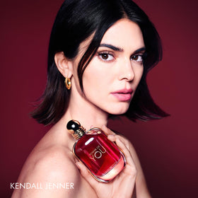 Armani Beauty bottle in hand for scale and ease-of-use visual reassurance