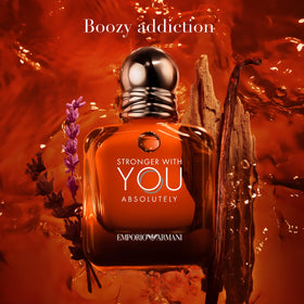Armani Beauty parfum being sprayed on wrist showing confident evening wear benefit