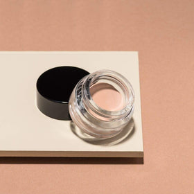 ARTDECO primer on dressing table with brushes showing ready-to-use everyday makeup routine
