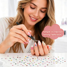 Artdone applying rhinestones to nail art to demonstrate neat, durable embellishment