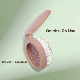 Arthaxi folded brush held in hand demonstrating pocket-sized portability and travel convenience