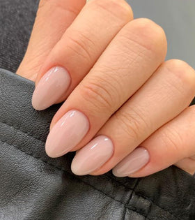 Artquee hand model wearing short almond nails showing comfortable fit and polished look